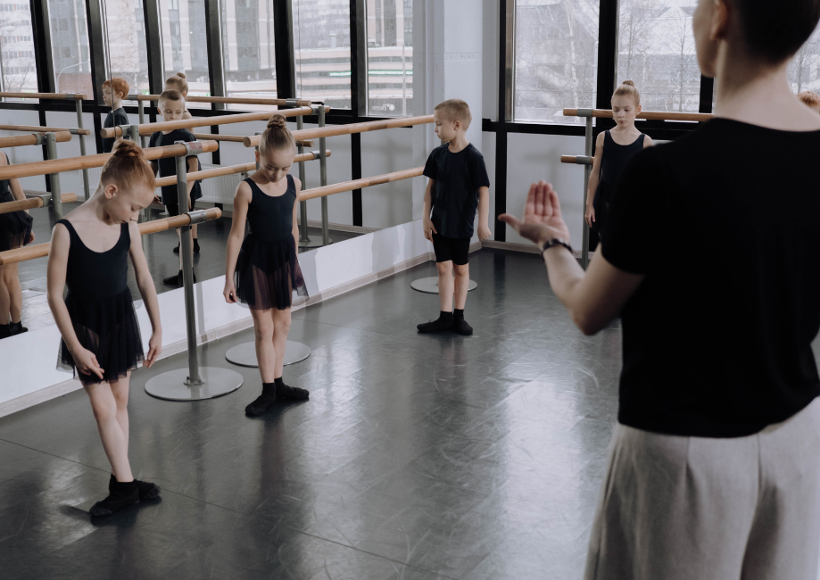 dance class, teacher out front 
